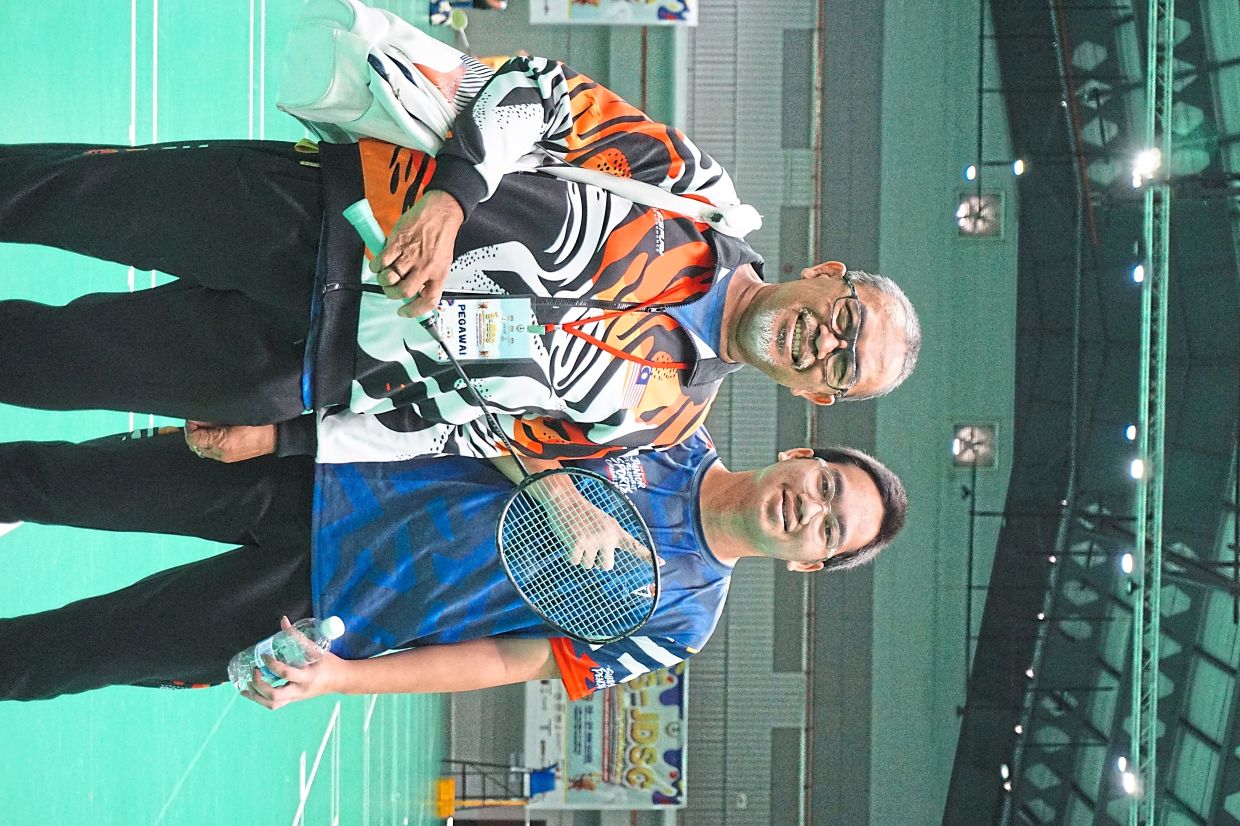 Hafiyyan with his father and coach Mat Noor.