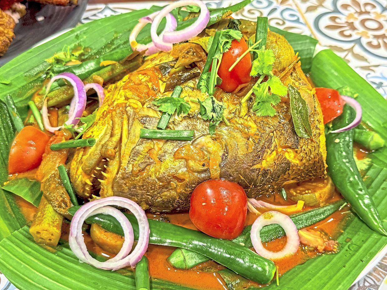 Fish head curry is ubiquitous in many nasi kandar eateries.