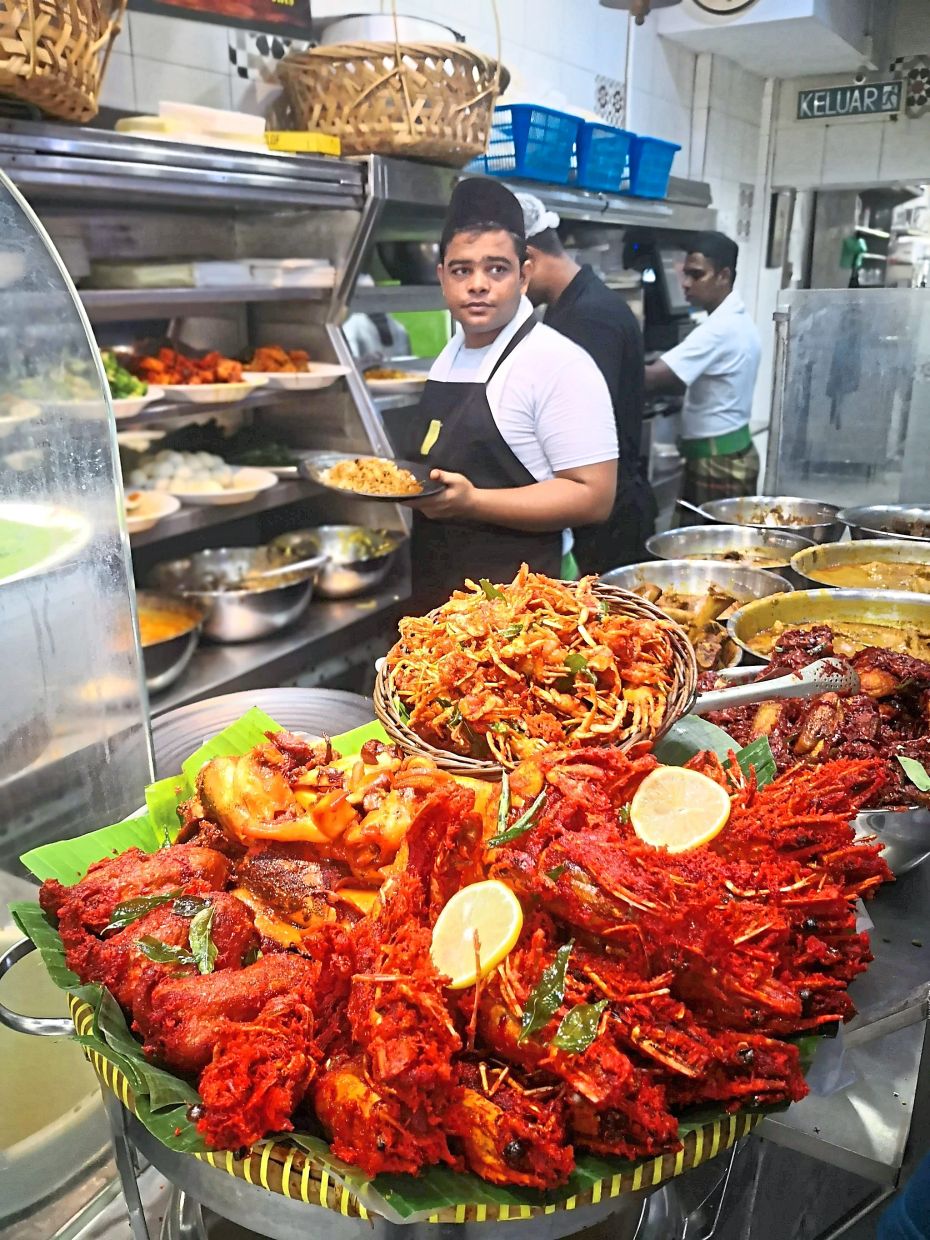 Nasi kandar comes with a large variety of tantalising side dishes.