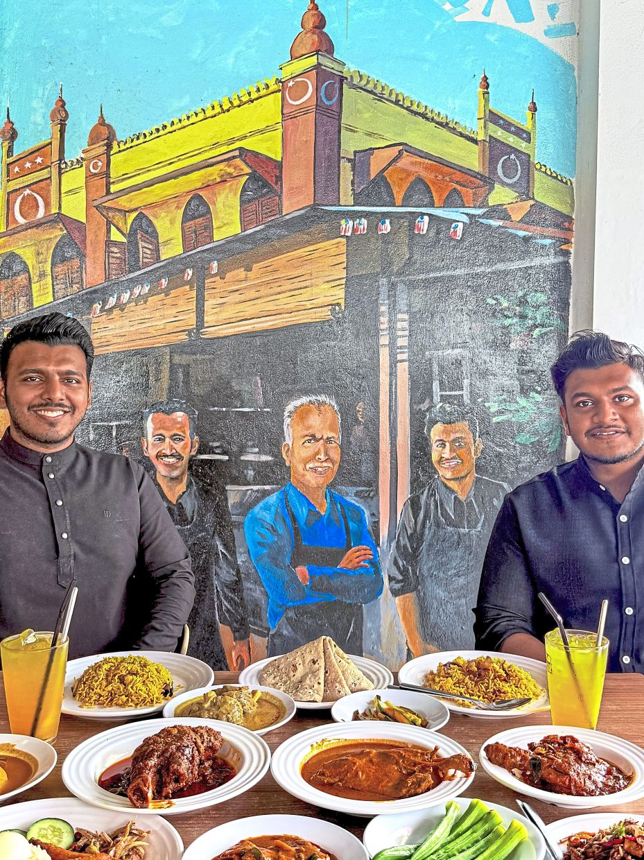 Maintaining food quality and consistency are important to Manzur’s sons, Muhd Aqram Zaki (left) and Mohammad Ershad Syafiq, who have set their sights on driving the business forward.