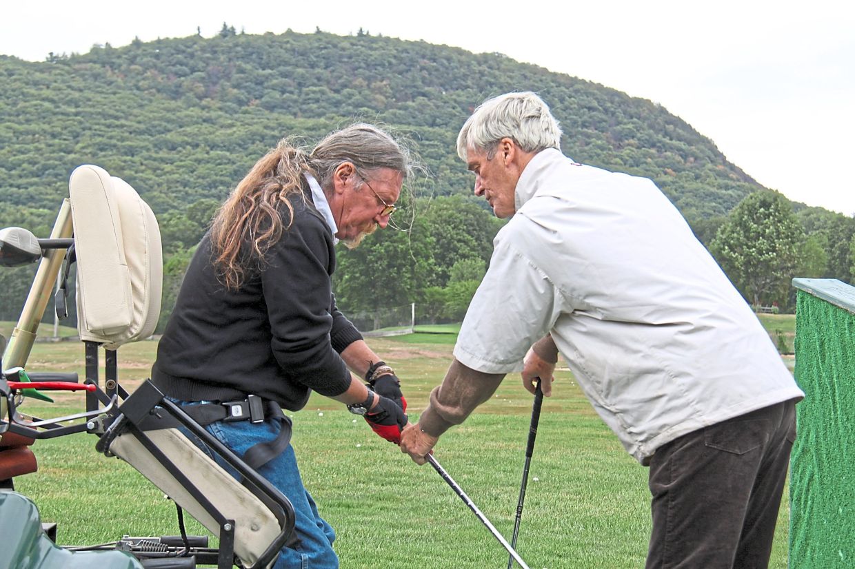 Selva (left), a long-time golf pro at Race Brook Country Club and Sleeping Giant golf course, has helped coach adaptive golf for the Gaylord Sports Association for 30 years.
