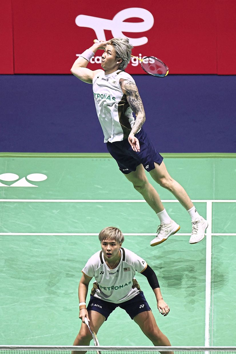 A job well done: Chen Tang Jie-Toh Ee Wei beat Hong Kong’s Tang Chun Man-Tse Ying Suet 21-12, 12-21, 21-17. — AFP
