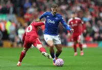 Soccer-Liverpool show depth to stay perfect, Tottenham draw at Brighton, Man United beat Chelsea