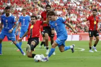 Soccer-Mallorca hold 10-man Atletico to 1-1 draw