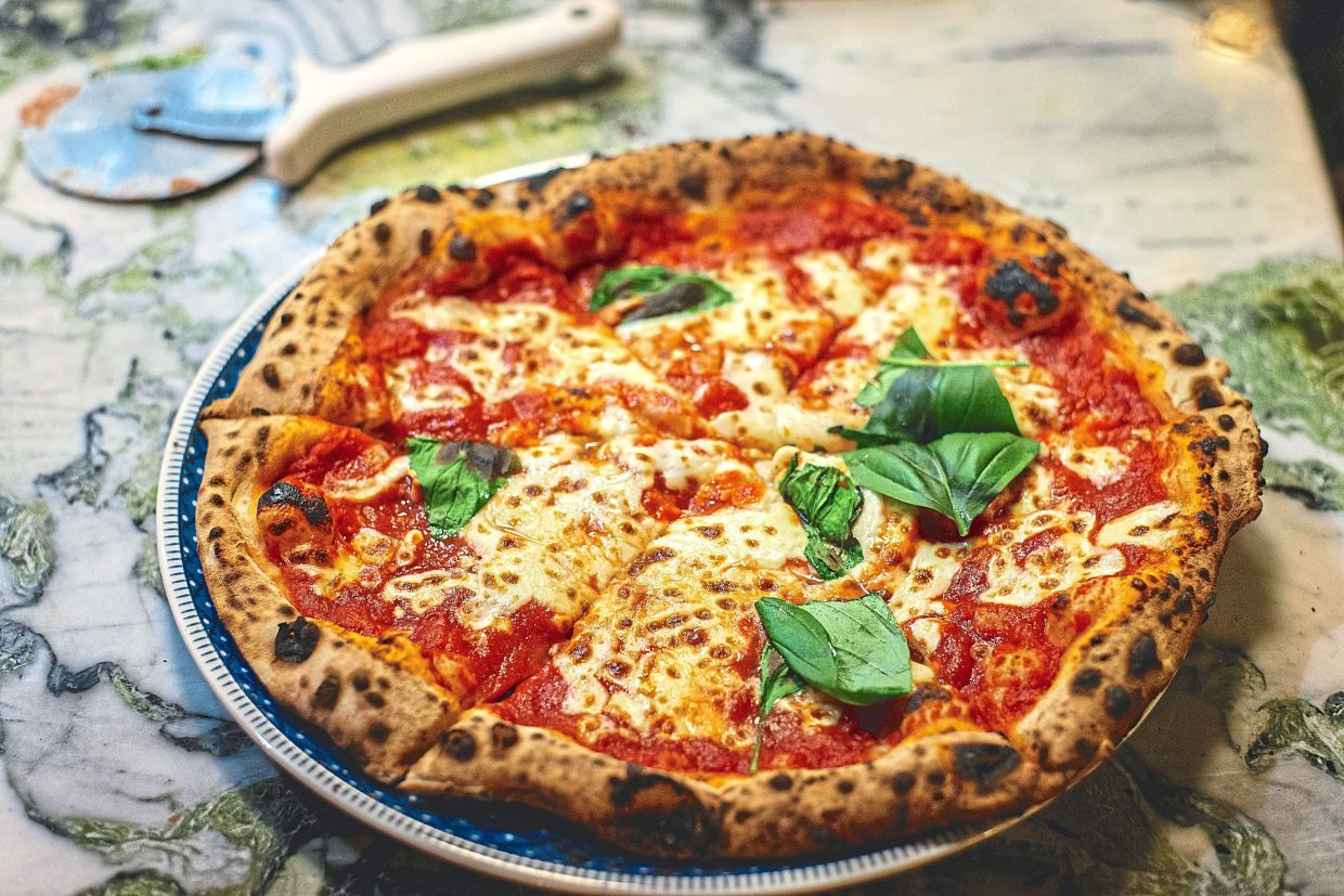 Head to the birthplace of the world-famous Neapolitan pizza in Campania's Naples. — AURELIEN LEMASSON-THEOBALD/Unsplash