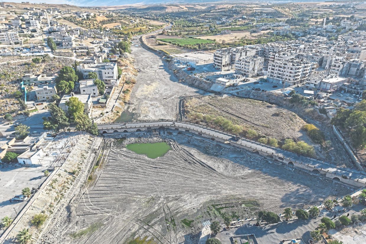 A drone view showing the dried up Orontes River in Jisr al-Shughur, west of Idlib. — AP