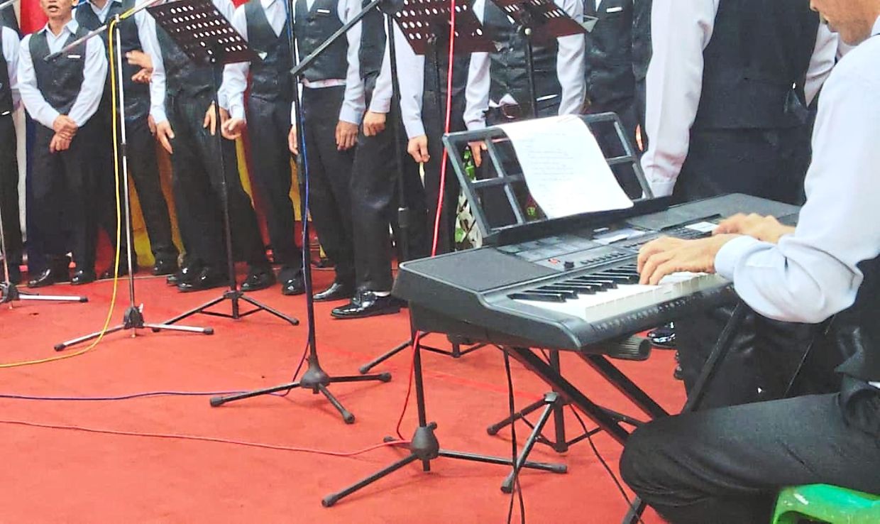 Kota Kinabalu Prison inmates performing for an audience that includes their family members. Twenty of the inmates have been selected for the two-year diploma course.