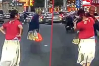 China woman shocked when elderly man she helps carry bags across busy road slaps her face