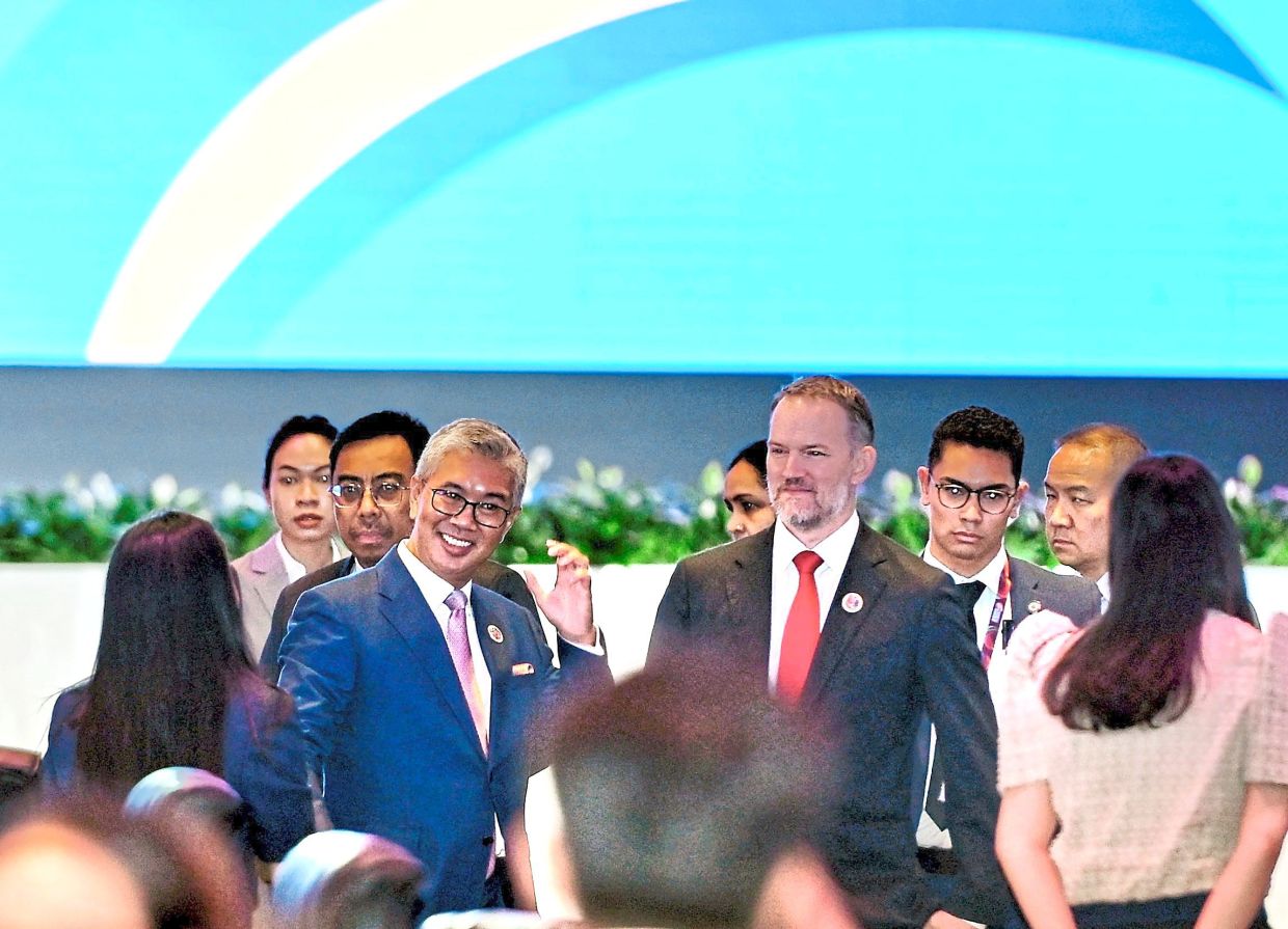 Down to business: Tengku Zafrul (front, left) and Greer attending the AEM-USTR consultation in Kuala Lumpur. — RAJA FAISAL HISHAN/The Star