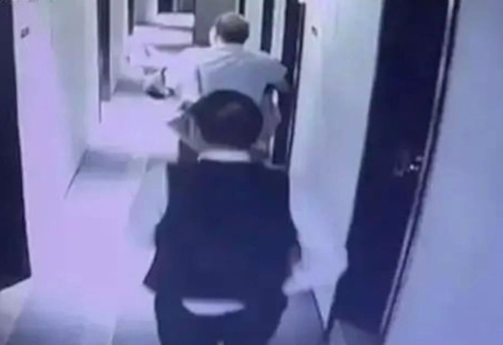 Surveillance footage captured Cui’s boss in black walking away from the hotel room. -- Photo: Handout