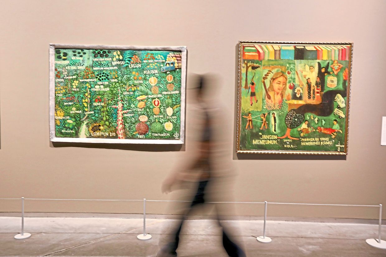 A view of paintings by the late Sabahan artist Inauk S. Gullah at 'The Plantation Plot' exhibition at Ilham Gallery. Photo: The Star/Low Lay Phon