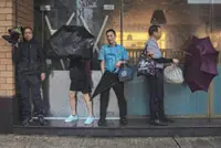 Hong Kong bankers pack hotels near offices for typhoon trading