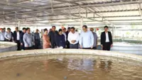 Lao PM praises success of fish farm, animal feed factories
