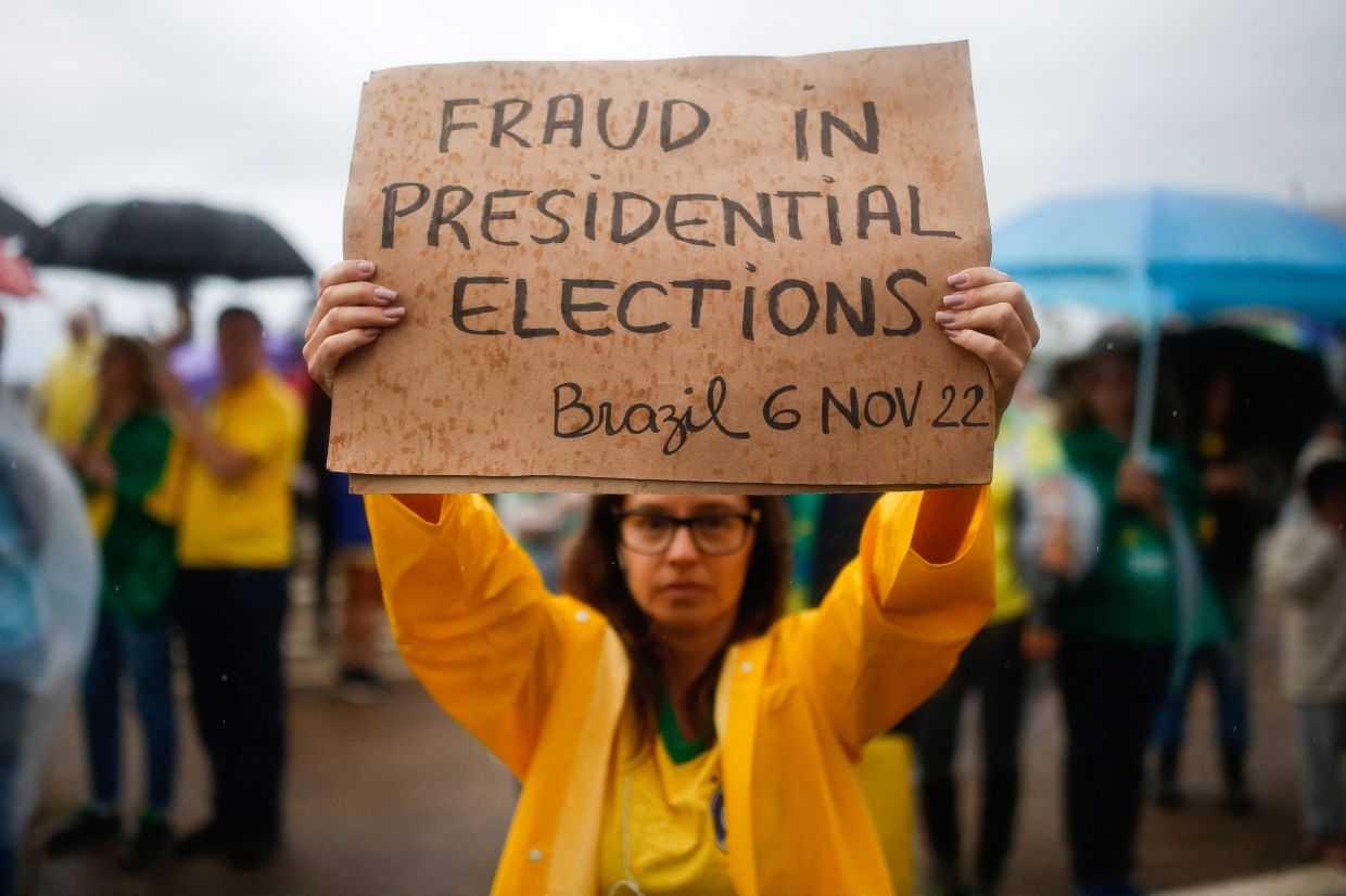Supporters of Bolsonaro taking part in a protest against the results of the run off election in front of the Army headquarters in Brasilia. — AFP