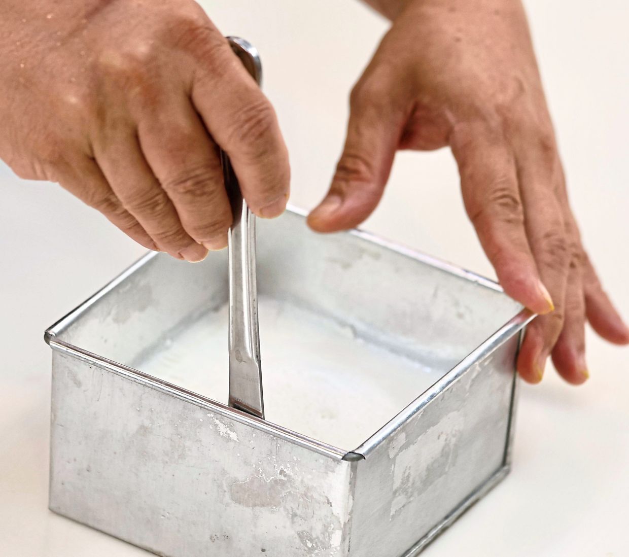 When set after an hour in the fridge, turn the almond jelly out and cut into cubes to serve.