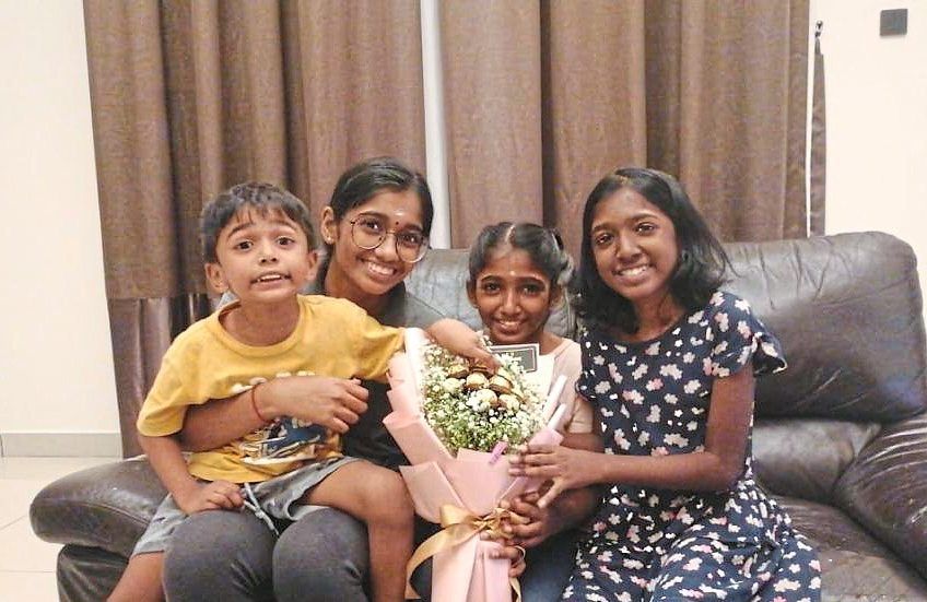 One for the album: Navena (second from left) having a sibling moment.