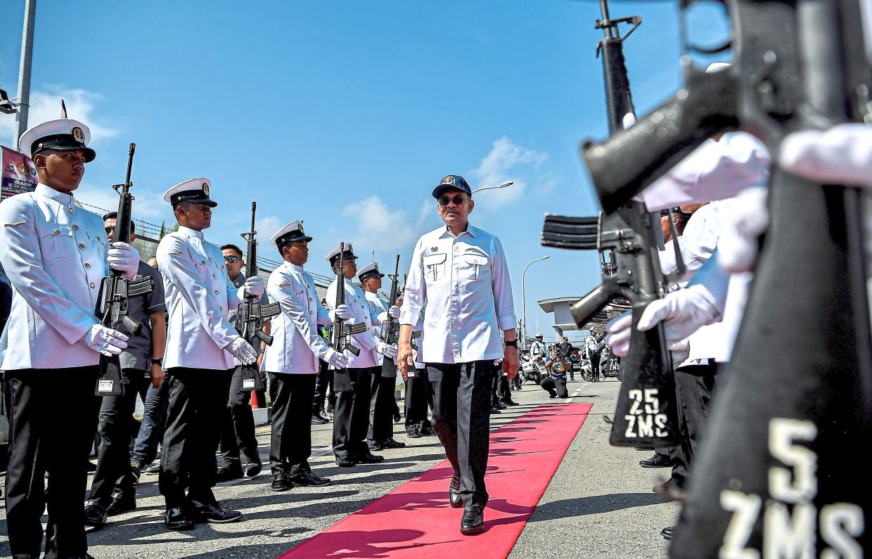 Marking a milestone: Anwar arriving at the Wira Madani Roadshow and the 20th anniversary celebration of the Malaysian Maritime Enforcement Agency at the MMEA Maritime Zone Com­plex in Sandakan. — Bernama