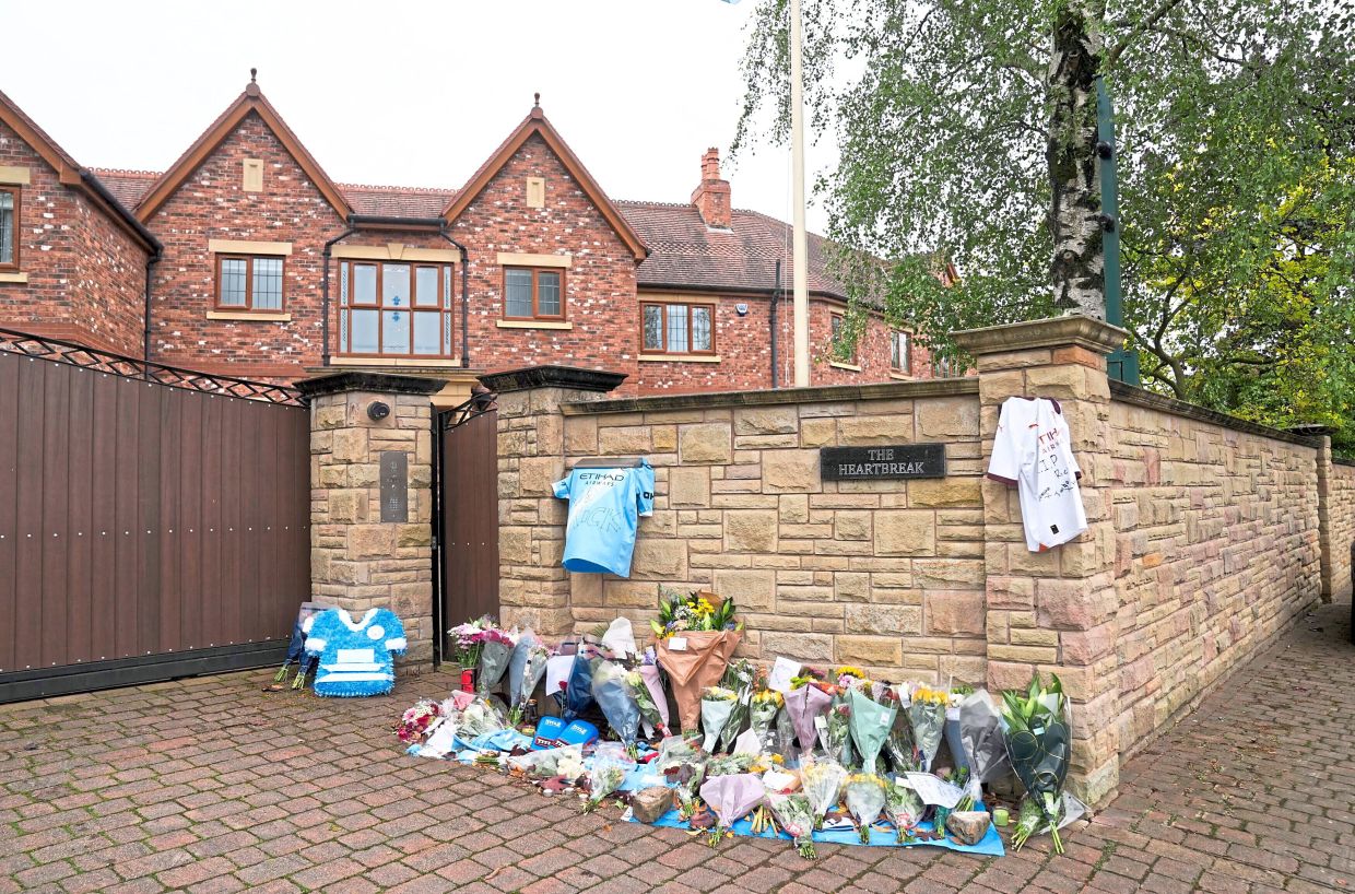 Tributes left outside Hatton’s home in Manchester on Sept 15. — AP