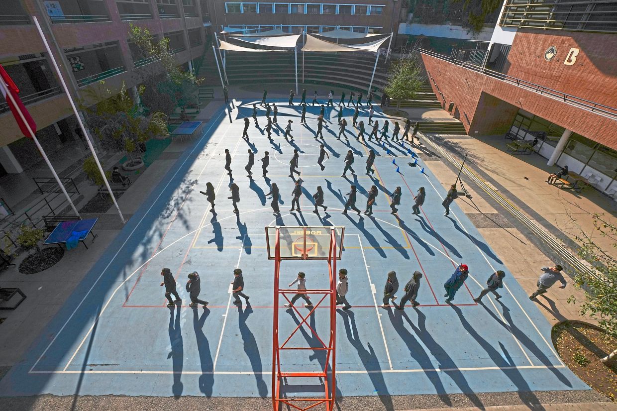 Students rehearse for an event to celebrate Chile's Independence at the school. Photo: AP