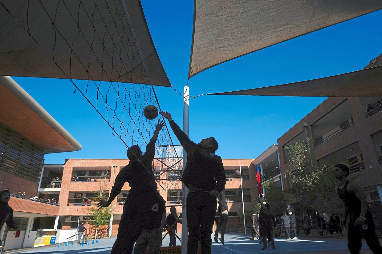 Students play volleyball at the school. Photo: AP