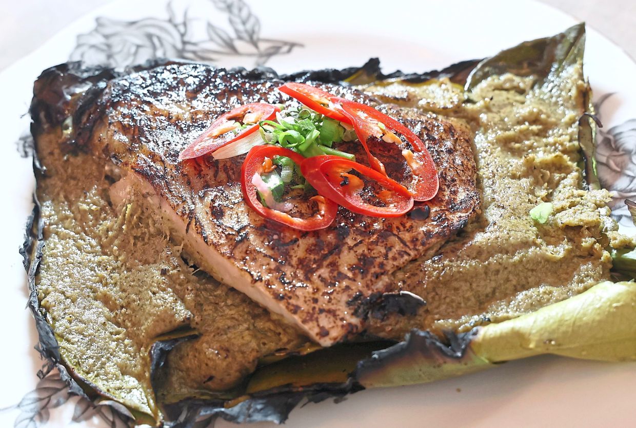 The baked fish features incredibly tender flesh and a paste that has lovely herbaceous qualities.