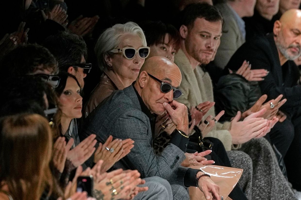 Throughout the runway show, set to music by Italian singer Patty Pravo, Streep's character consulted with Tucci, their eyes casting up and down the runway as models passed. Photo: AP