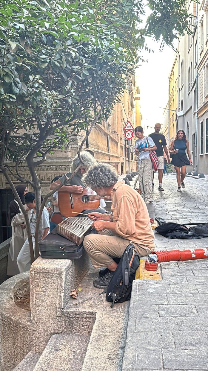 Two street musicians playing traditional Turkish folk tunes.