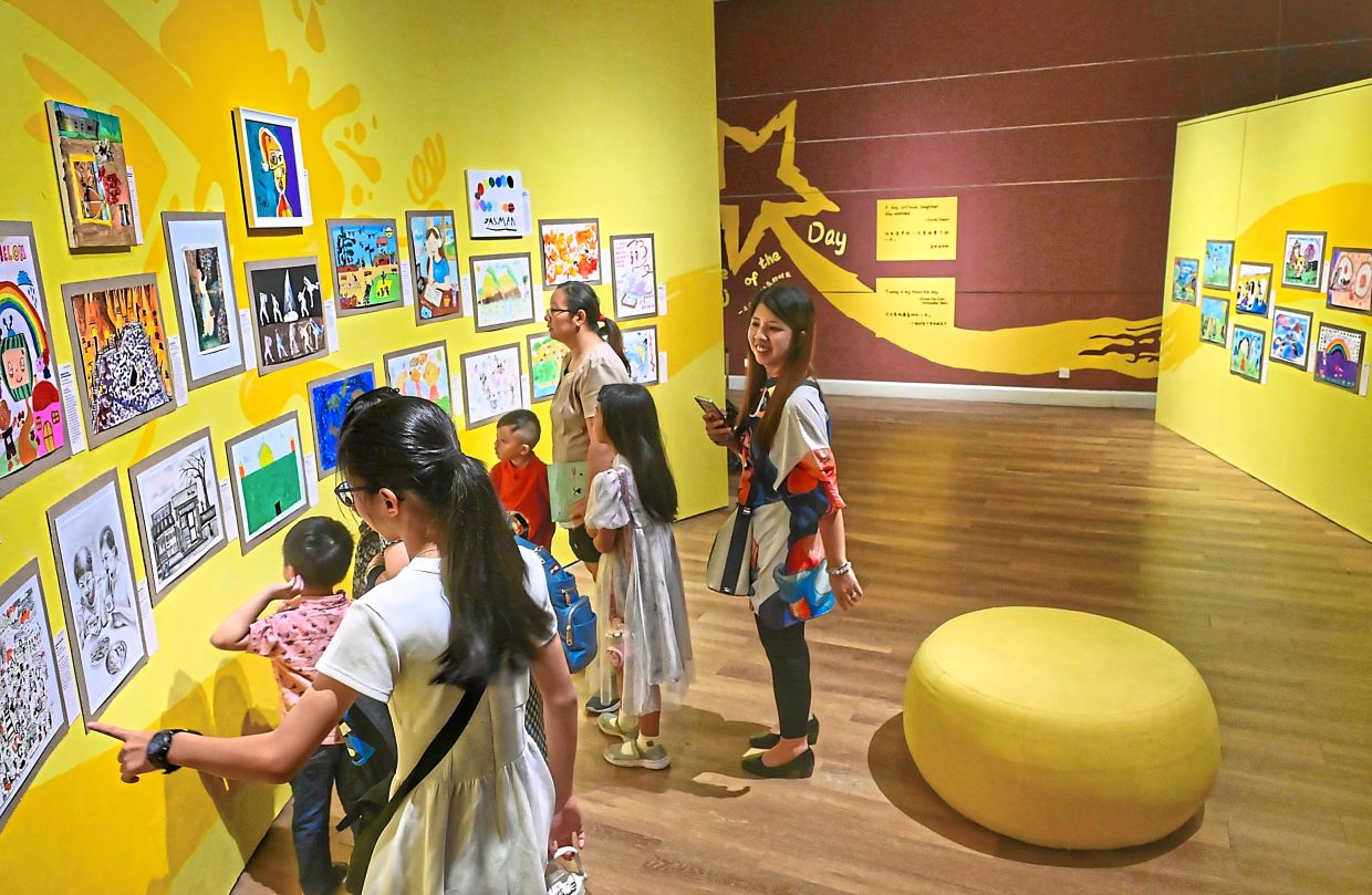 Visitors exploring the ‘Ta-Da! Look at My Lines!’ children’s art exhibition held until Oct 12 at Wisma Kebudayaan SGM in Kuala Lumpur. — Photos: RAJA FAISAL HISHAN and ADANI ZAIDI/The Star