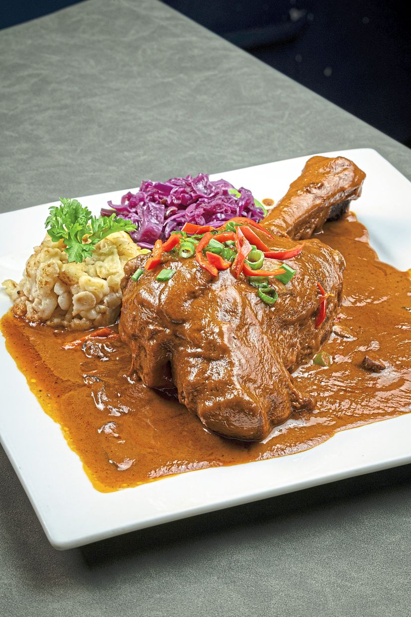 Hungarian Lamb Shank Braised in Mushroom Sauce from the menu’s meat section.