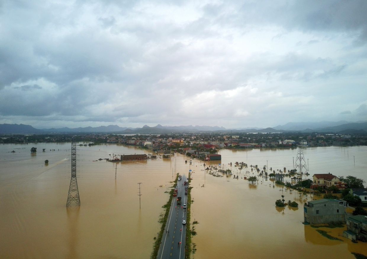 This aerial photo shows flooding caused by rain following typhoon Bualoi in Thanh Hoa, Vietnam, Tuesday, Sept 30, 2025. - Photo: VNA via AP