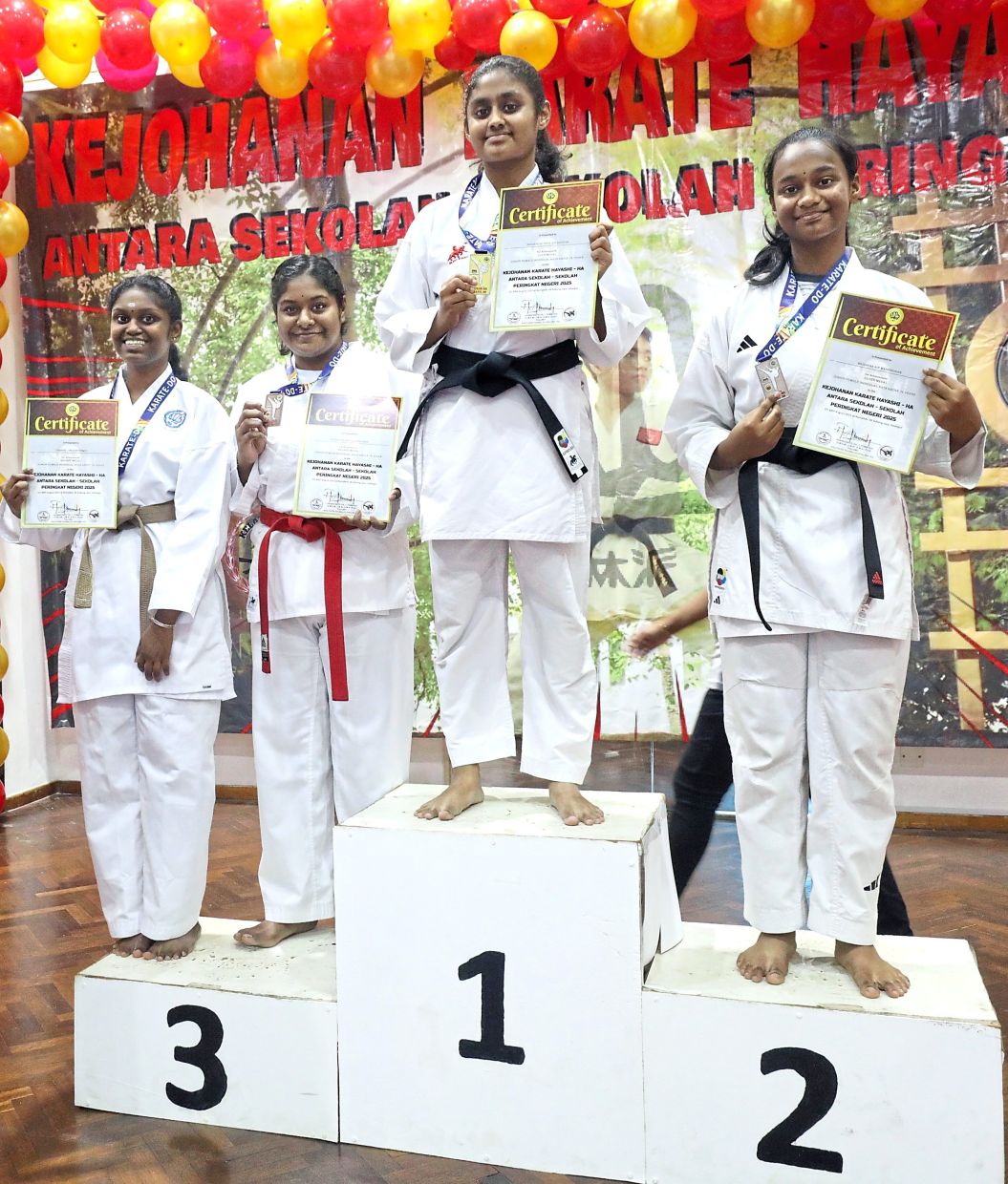 Winners of a kata competition category with their prizes. — Photos: SAMUEL ONG/The Star