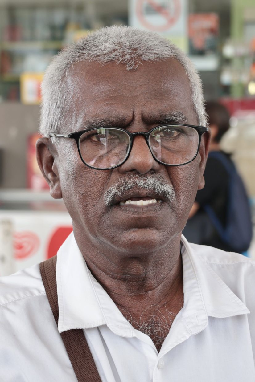 Personal driver B. Karunaniti, 73, was surprised by the subsidised RON95 and was pleased by the initiative when met at a petrol station along Weld Quay, in George Town, Penang. — ZHAFARAN NASIB/The Star.