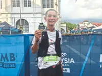 Yih Huan, 45, shows he can stay on the trail of younger runners