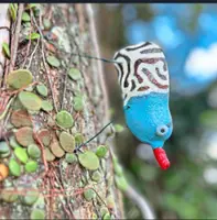 Sarawakian architect paints 31 stinking toe pods, installs them on trees in Kuching