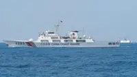 China holds National Day ceremony in waters off atoll claimed by Philippines
