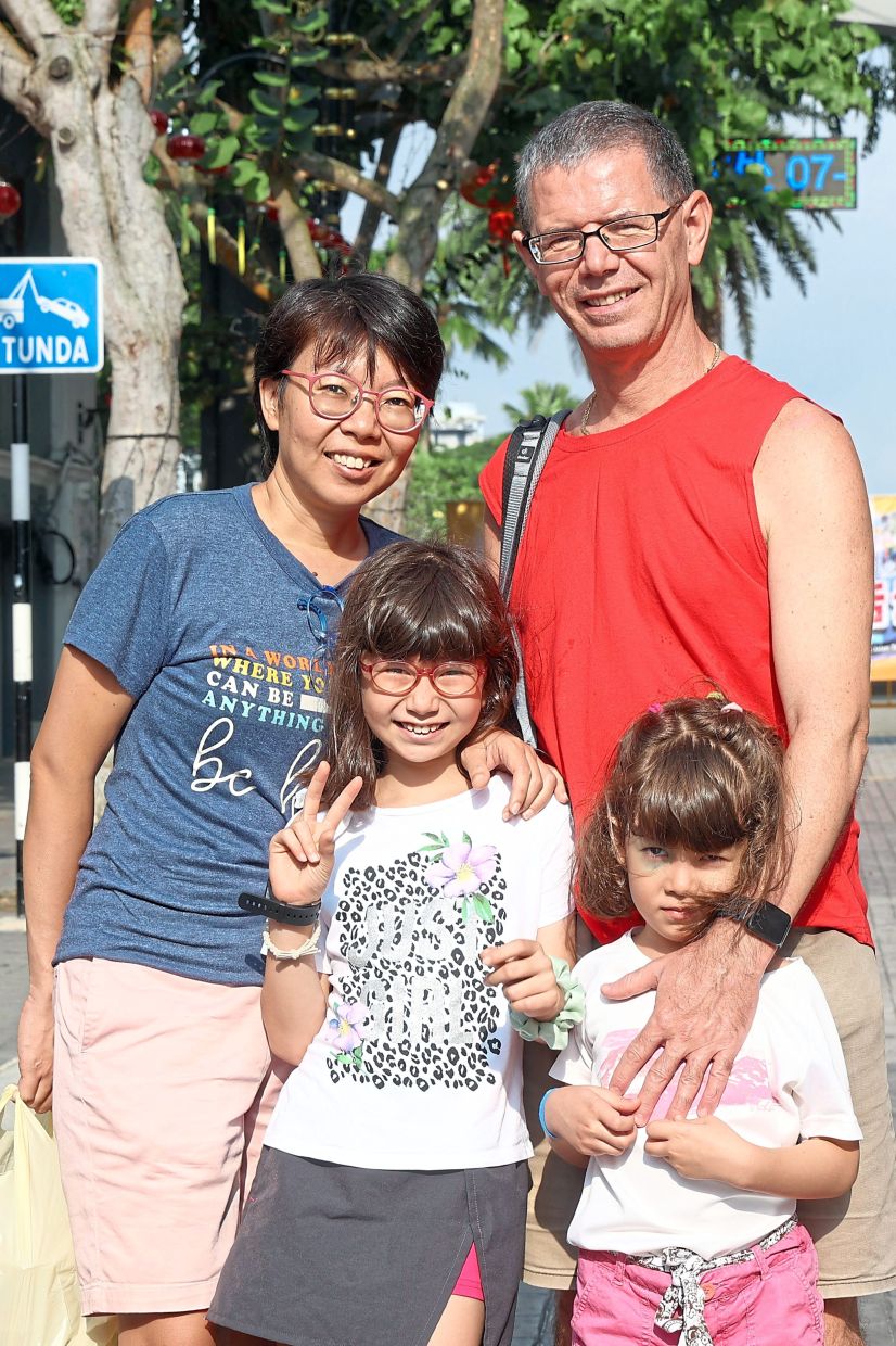 Renon (right) says he and his family will be back to see more of the market.