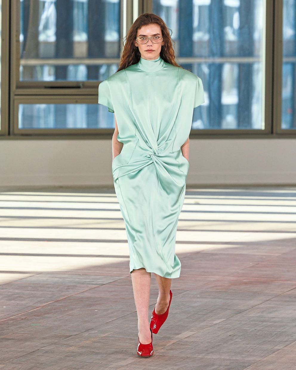 Something interesting and refreshingly different is the detail on this cocktail dress where a reverse knot sits at the centre. Photo: Stella McCartney