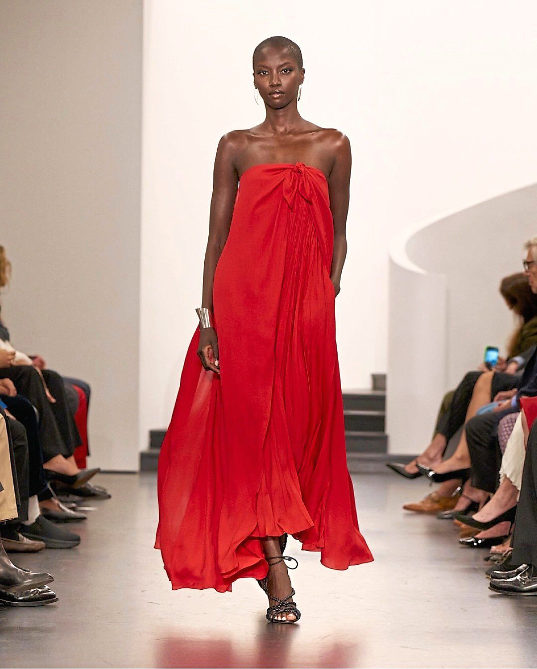 This dress design is cinched with a knot and tie, flowing into a beautifully draped sarong-inspired silhouette. Photo: Instagram/Ralph Lauren