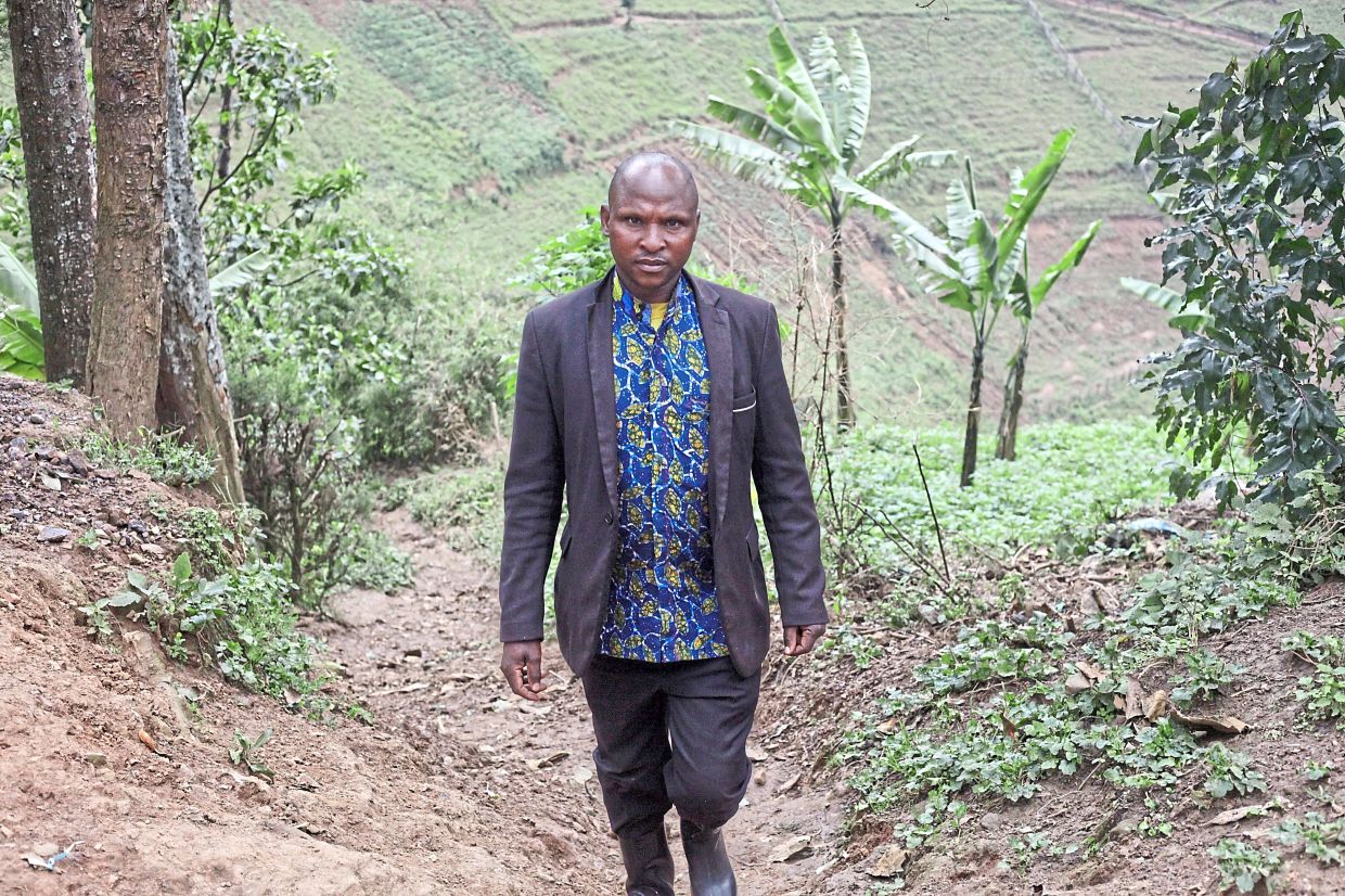 Mujuni is a reformed poacher who now guards the forest from illegal hunters.