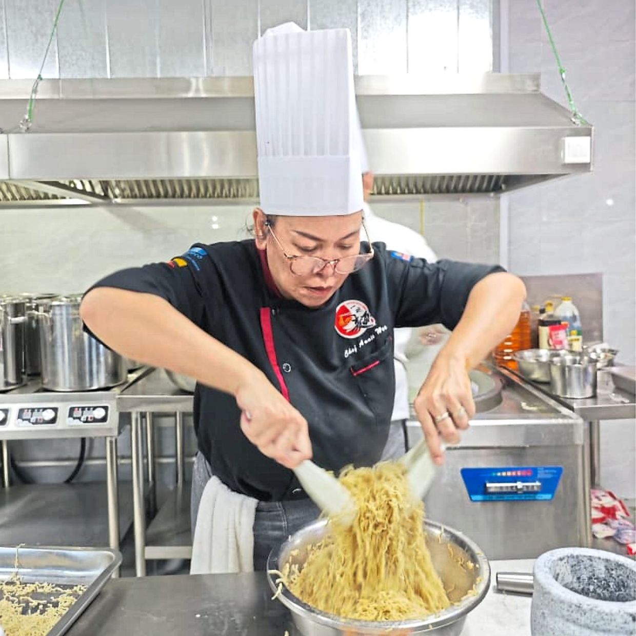 Wee making the iconic Sarawak Kolo Mee.