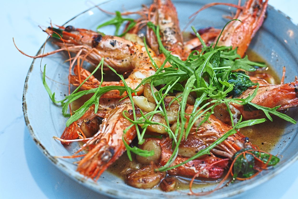 Spanish Prawns in Wine with whole confit garlic and dried chillies.