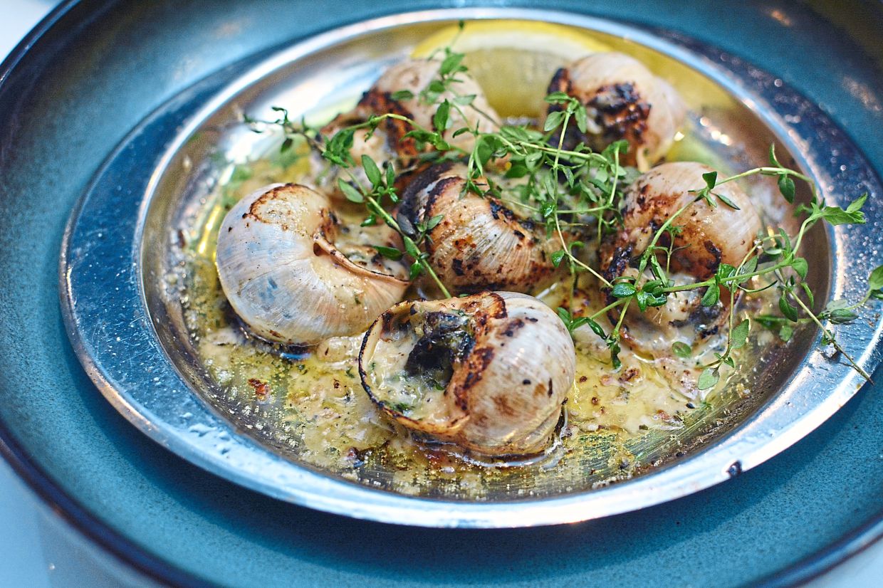 French Baked Escargots in a bubbly butter-garlic sauce.