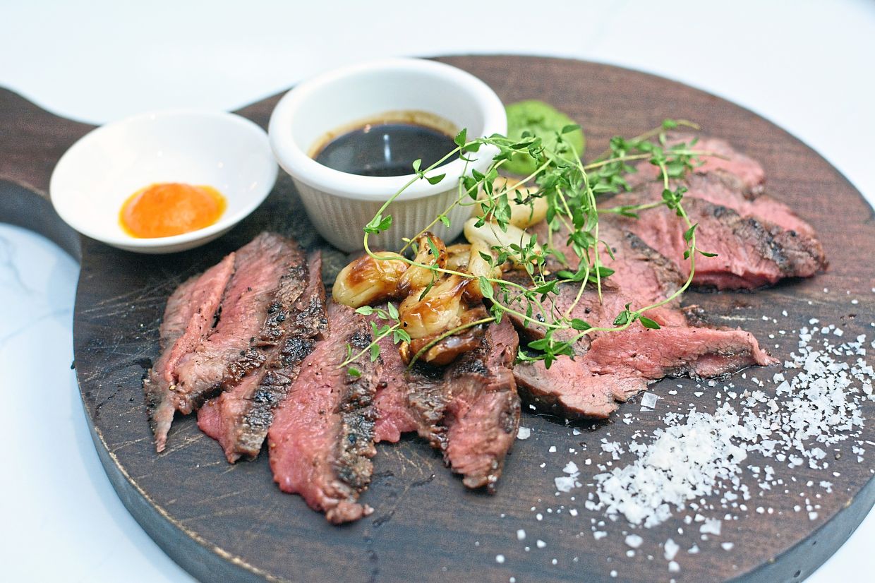 Wagyu Oyster Blade served with confit garlic and dipping sauces