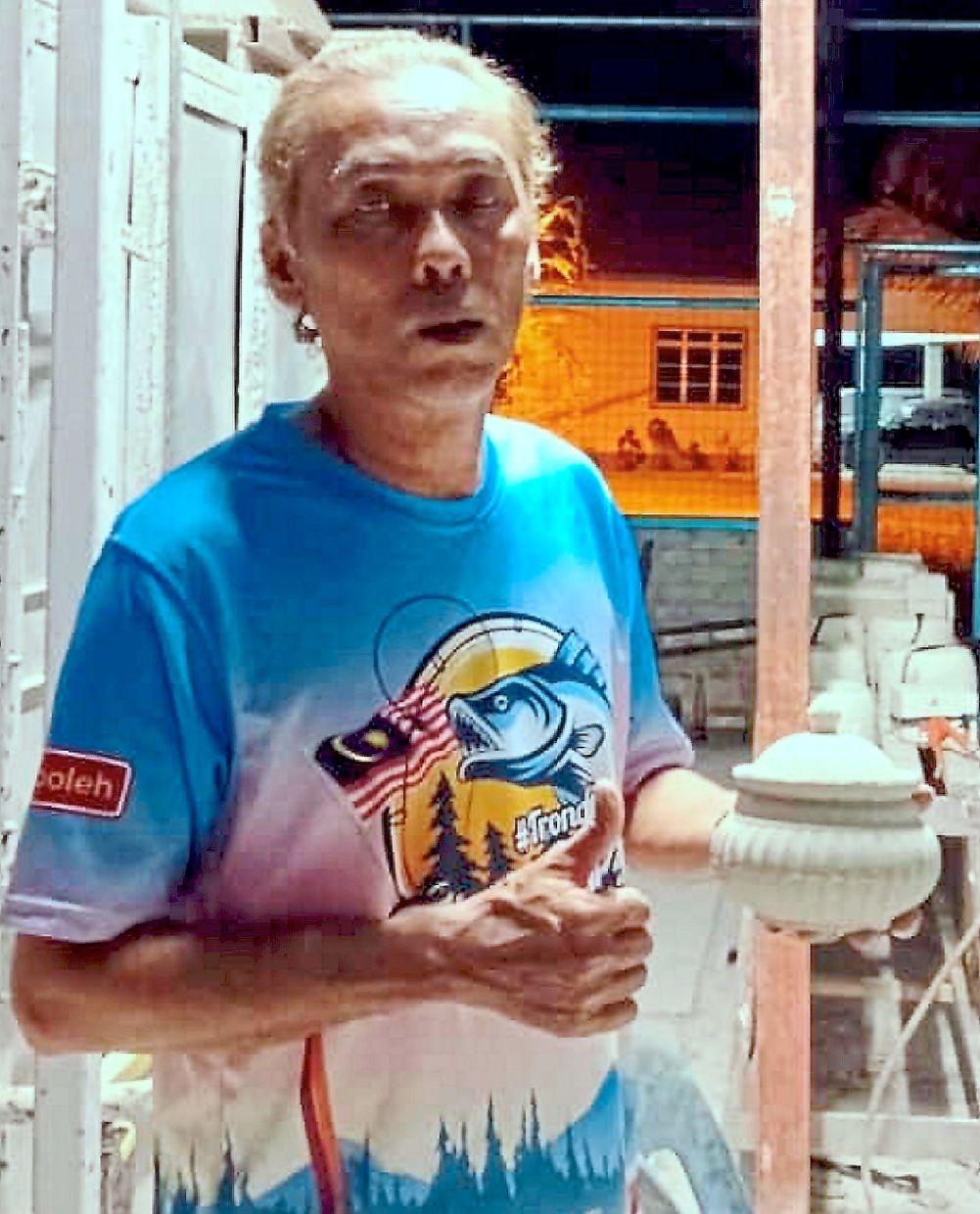 Mazlan showing one of the products he made.