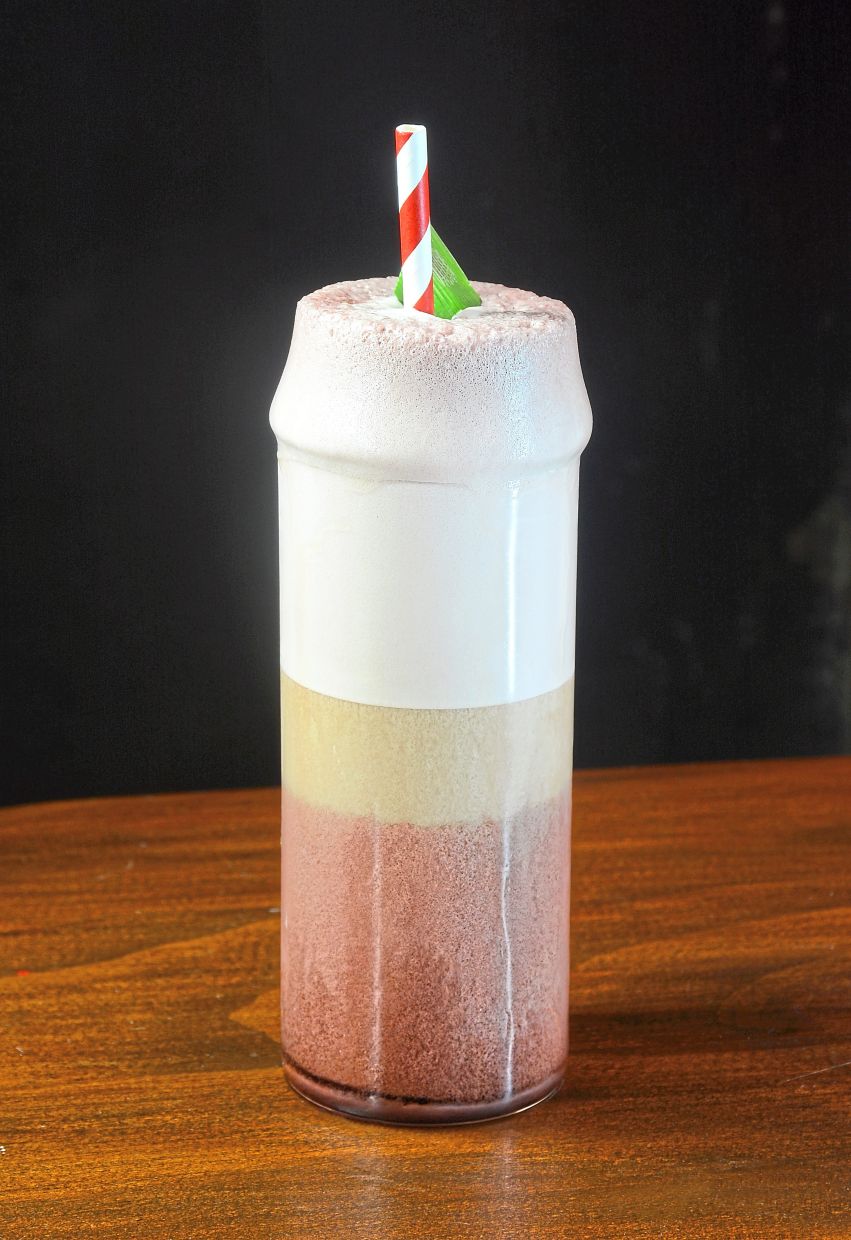 I Purple You combines the frothy theatrics of a Ramos Gin Fizz with the flavour profile of the black glutinous rice dessert.