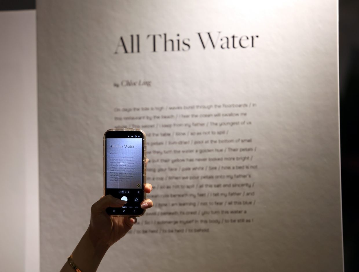 While the event was not held in an art gallery, the cafe space prominently displayed the poems, giving them a central presence for visitors to engage with. Photo: The Star/Chan Tak Kong