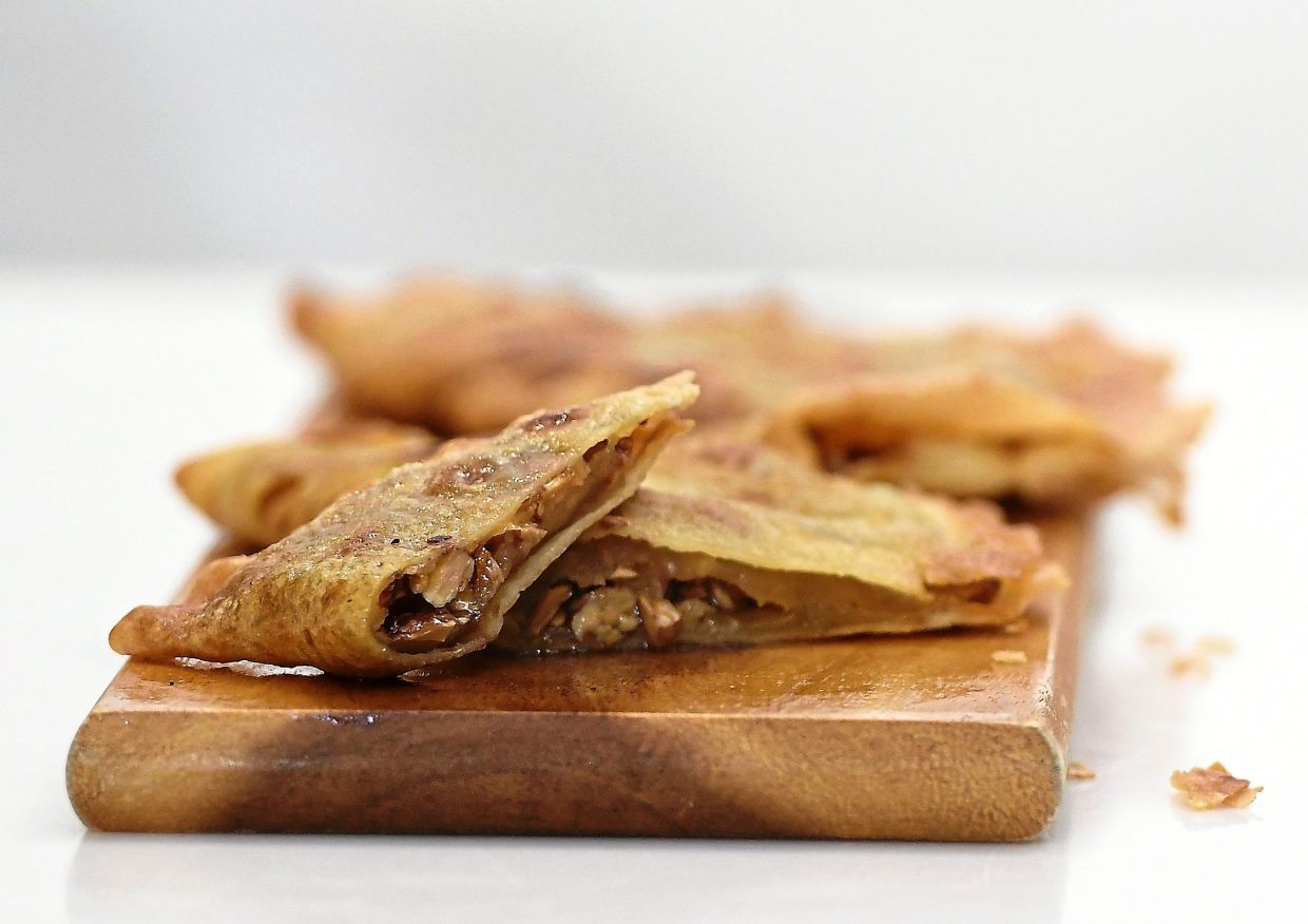 A smattering of ingredients and you have delightful Shanghai pancakes (right) for Mid-Autumn Festival. — Photos: ONG SOON HIN/The Star