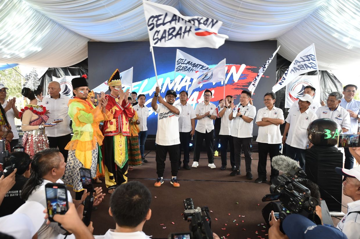 No second chance for defectors, says Shafie 1 Supporters waving the “Selamatkan Sabah” flags during the launch of Warisan's state election campaign slogan in Tawau.