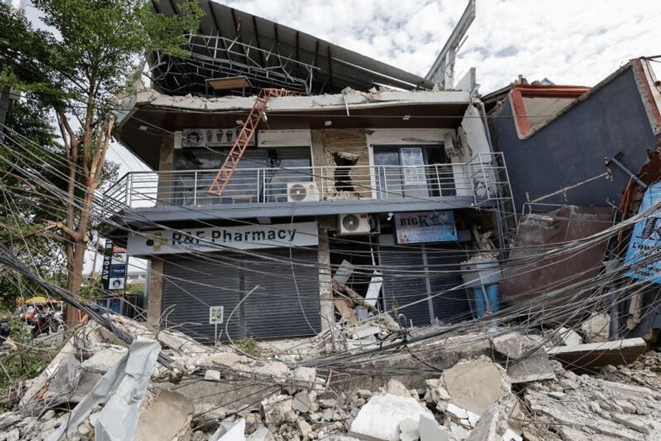Rubble surrounds a building damaged by an earthquake in San Remigio, Cebu, Philippines, on Oct 2, 2025. -- PHOTO: EPA