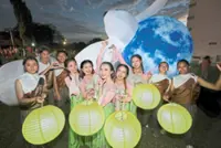Lanterns, fun and street food light up cemetery
